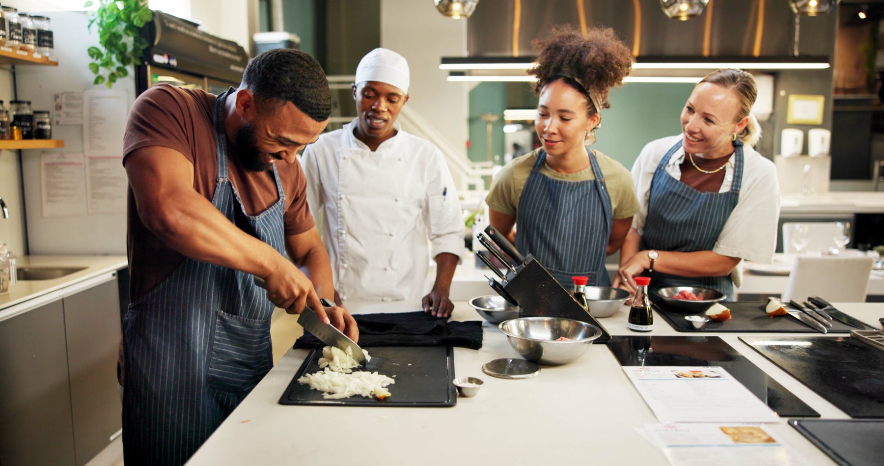 Restaurant manager training a new employee