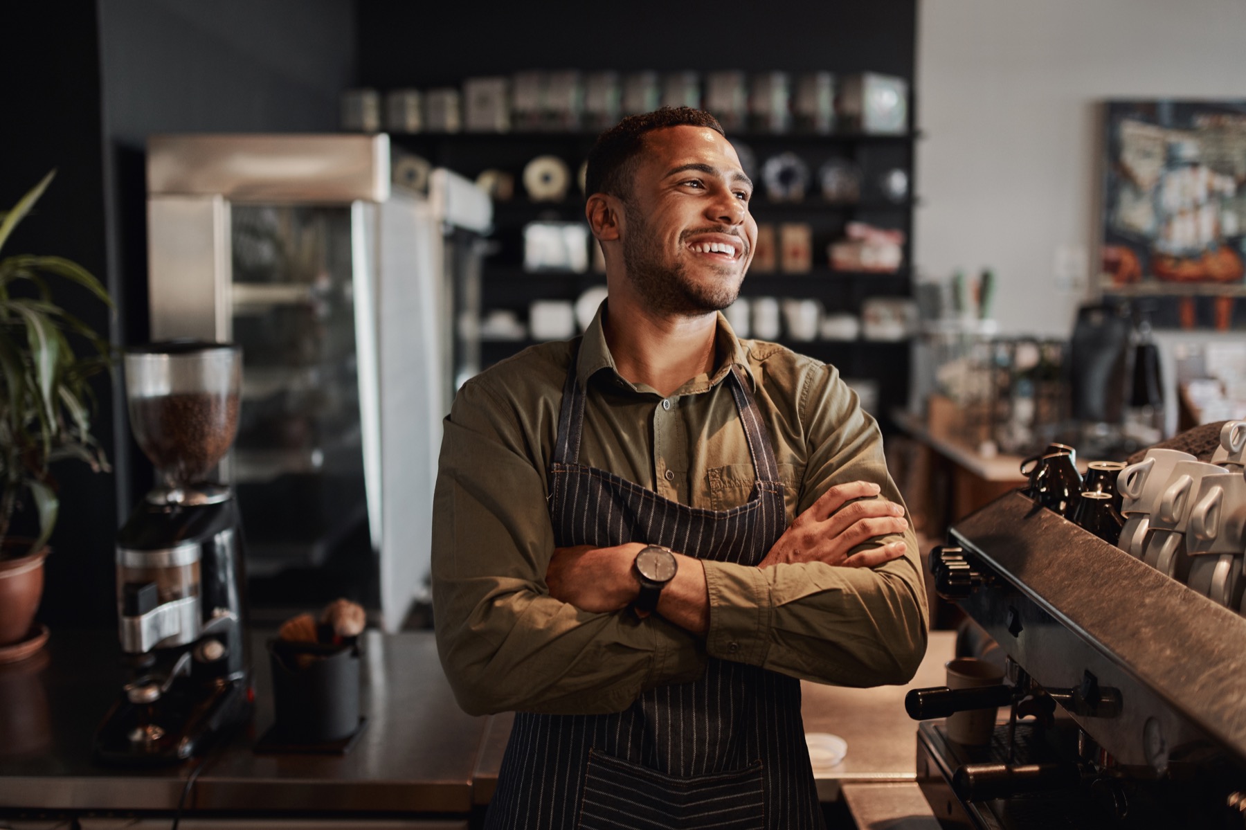 Happy restaurant manager working efficiently